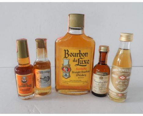 Half vintage bottle of Bourbon de Luxe of Kentucky together with other miniature bottles of bourbon and a vintage miniature b
