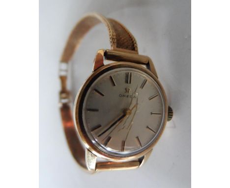 A vintage unboxed Omega 9ct gold ladies watch set to a 9ct gold bracelet strap,19 grams gross 