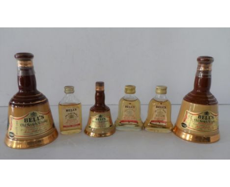 Six bottles of vintage Bells blended whiskey including 3 of the iconic "bell" bottle examples, all unopened (6) 
