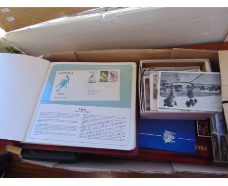A qty of first day covers and coins sets