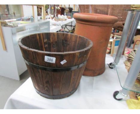 A wooden planter and a terracotta pot