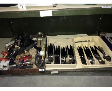 A shelf of assorted cutlery