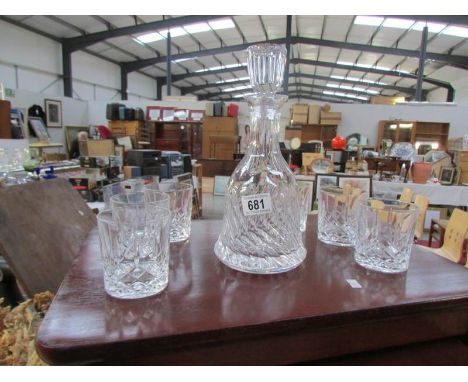 A cut glass decanter and 6 glasses