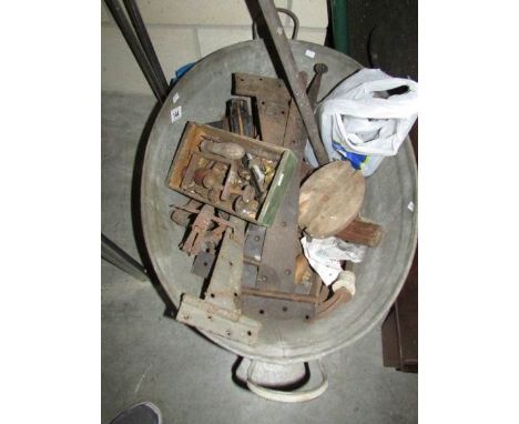 A tin bath and contents including door furniture, tools etc