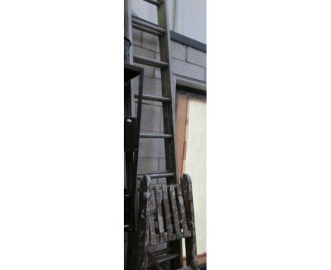 A large double ladder, a step ladder and a decorated ladder