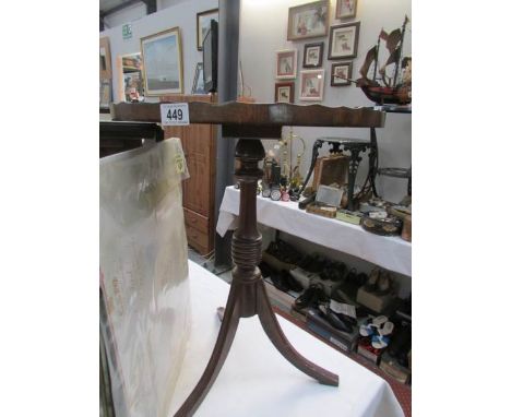 A leather topped tripod wine table