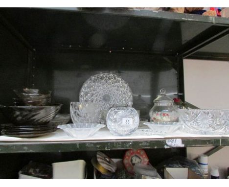 A shelf of glass ware