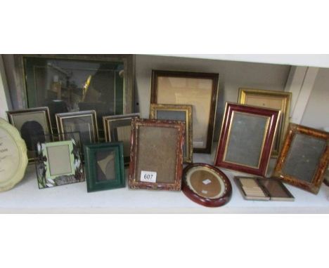 A shelf of photo frames