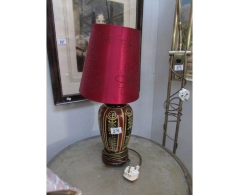 A ceramic table lamp with shade