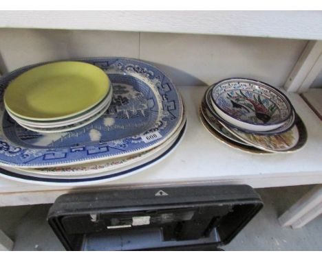 A shelf of meat platters, plates etc