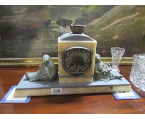 A French art deco marble mantel clock surmounted boy and girl