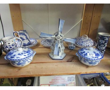 A shelf of blue and white included lidded bowls