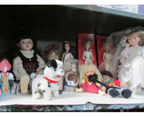 A shelf of dolls and other toys