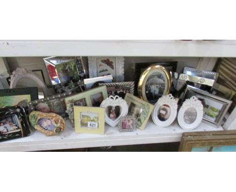 A shelf of photo frames