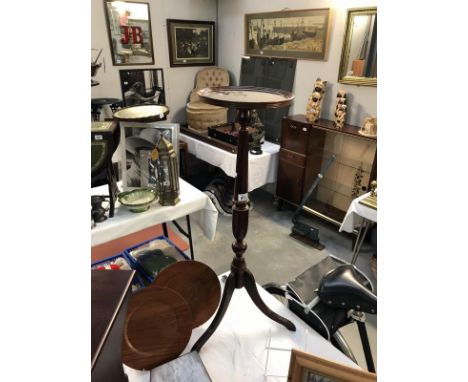 A mahogany tripod plant stand