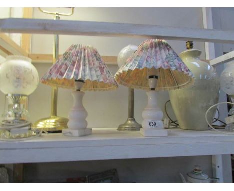 A shelf of table lamps