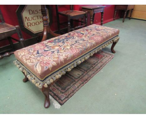 A 19th Century oak duet foot stool, the tapestry upholstered seat with bullion frieze on cabriole feet,  115cm long  