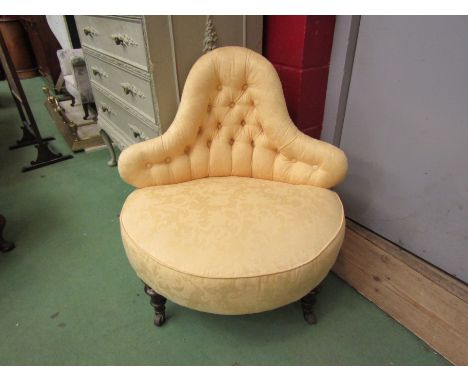 A Victorian walnut button back corner nursing chair, the bow front seat over turned and tapering reeded legs having gilt pain