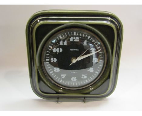 A retro Metamec quartz wall clock with green ceramic surround, 22cm x 22cm