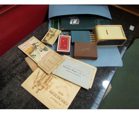 A collection of cigarette cards including players, postcards of the same period, playing cards and a cigarette dispenser etc 