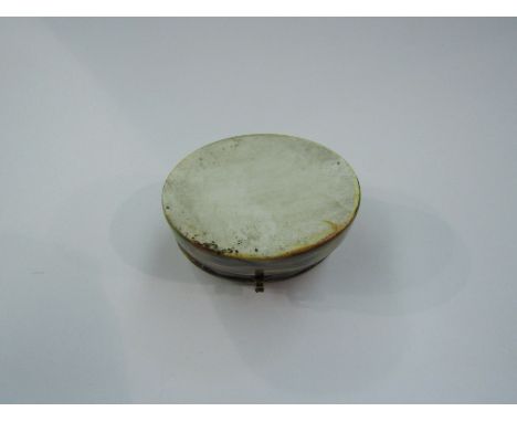 An 18th Century ceramic oval patch box, 6cm x 4cm, handpainted, hinged.  Lady and gent in garden.  Hardstone base
