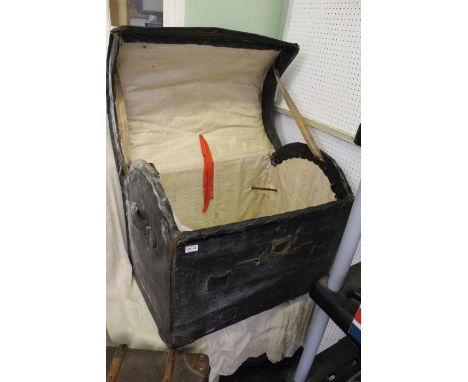 A large canvas covered domed top trunk
