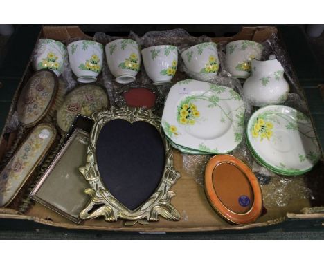A box containing a Lawley's of Regent Street floral decorated part tea service, photo frames, etc