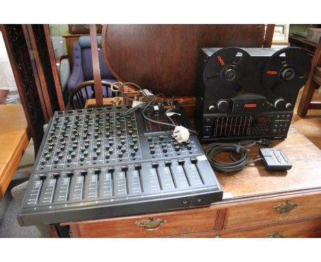 A Fostex 8 track, model 450 mixing console together with a Fostex model 80 reel to reel recorder, with remote