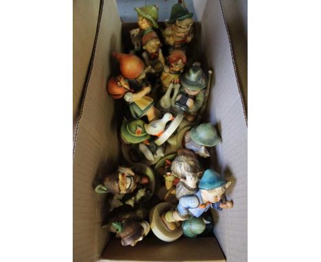 A selection of Hummel Goebel figurines, children mostly with animals, ranging from 8cm to 15cm
