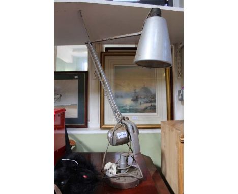 A mid century weighted adjustable task lamp 