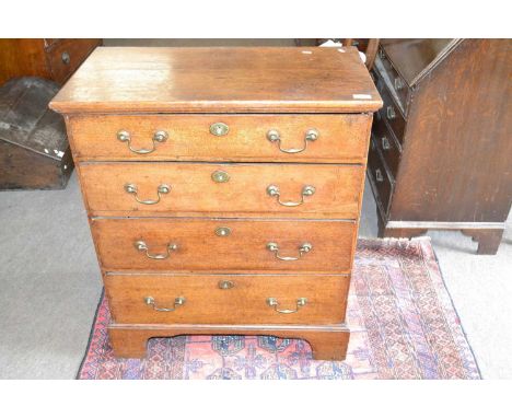 Small George III oak chest of four graduated drawers fitted with brass swan neck handles and raised on bracket feet, 74cm wid