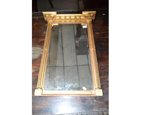 A small 19th Century gilt wood pier mirror with architectural frame, 75cm high