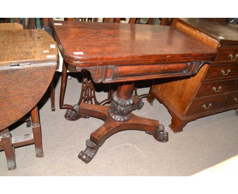 19th century mahogany card table with folding revolving baize lined top over a turned column, platform base and four scrolled