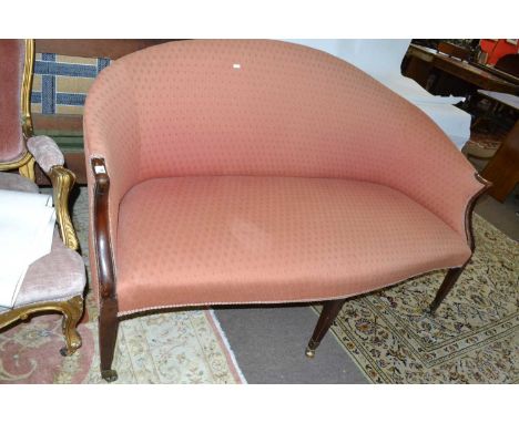 19th Century mahogany framed high back sofa with serpentine front seat and supported on six tapering legs with brass casters