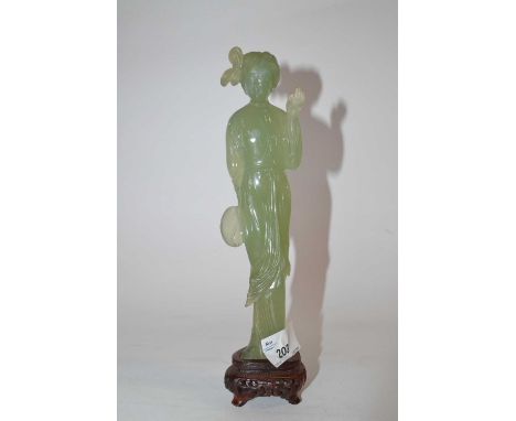 A jade figure of a Chinese lady on pierced wooden base, 22cm high