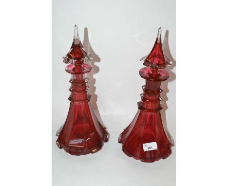 A pair of 19th Century ruby three ring neck decanters with covers, 35cm hign