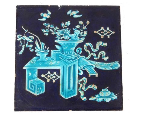 A Minton &amp; Hollins tile, decorated in Chinese fashion, the blue ground with precious objects in a turquoise glaze, 20cm d