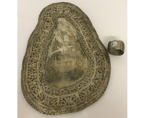  Together with a white metal vintage serviette ring decorated with scroll and elephant decoration with empty cartouche a/f. 