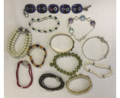  To include: freshwater pearl, amber and rolled gold. 