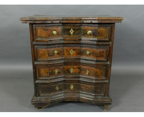 A late 17th century Italian walnut commode, having concave block front, fitted four drawers. H.83cm, W.76cm, D.47cm
