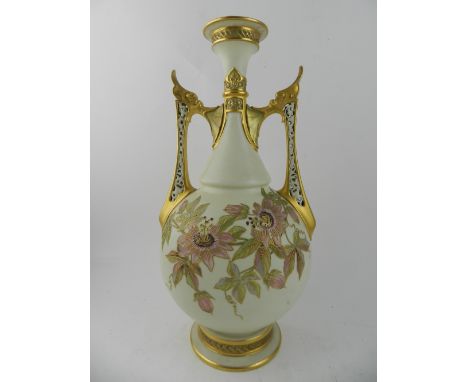 A Victorian Royal Worcester blush ivory twin handled vase, having floral decoration highlighted in gilt to front and back, be