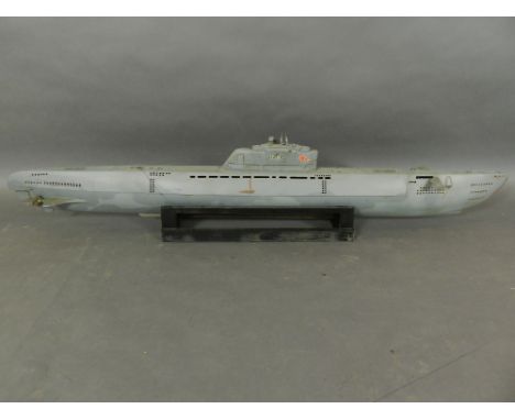 An unusual scale radio controlled model of a German submarine, together with radio controller. L.164cm