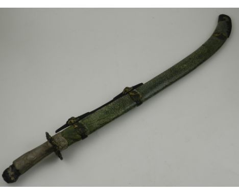 A late 19th / early 20th century Japanese Katana, having shagreen scabbard and white metal hilt. L.69cm