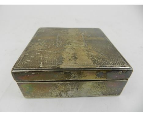 Asprey, London. An Edwardian silver cigarette case, having an engine turned hinged top centred with a vacant cartouche, hallm