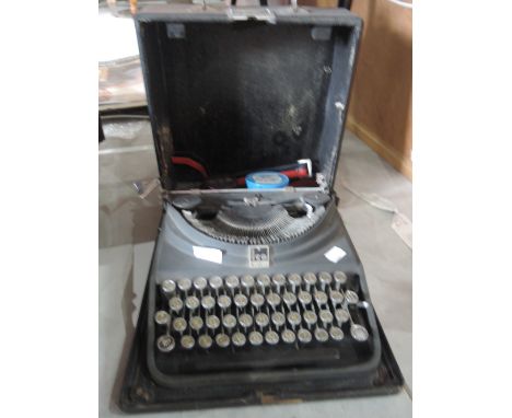 A vintage ICO Olivetti typewriter in hard case