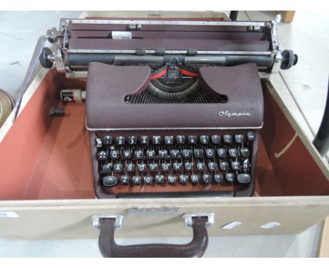 A vintage Olympia typewriter in hard carry case. 