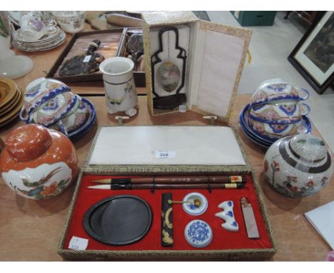 A selection of Oriental ware including raku glazed ginger jar, eggshell tea service, Oriental brush writing set etc