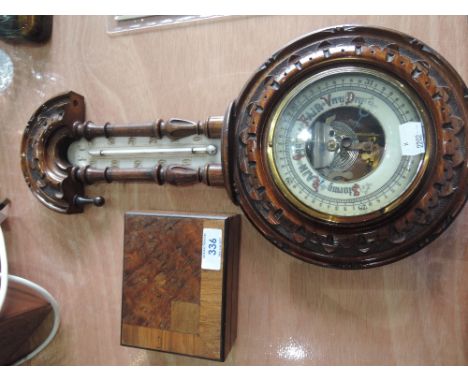 A carved treen barometer and small inlaid box