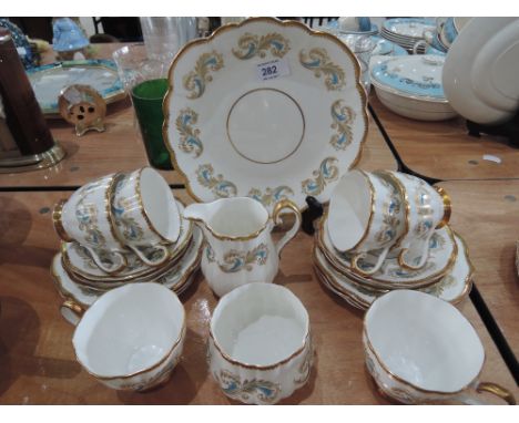 An Elizabethan part tea service in white and gilt with turquoise and gilt decoration