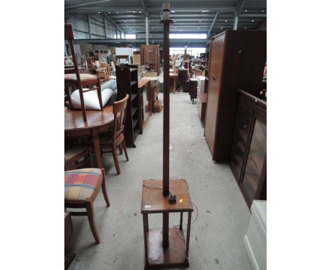 A vintage magohany standard lamp on shelf base
